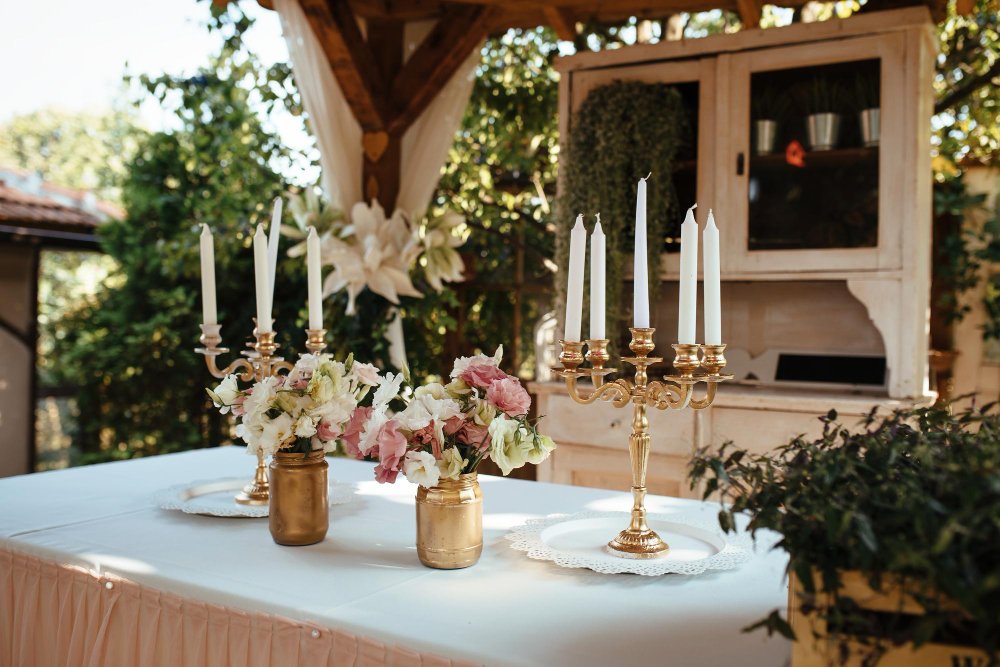 Stylish wedding tablescape with candlelight and neutral-toned decor